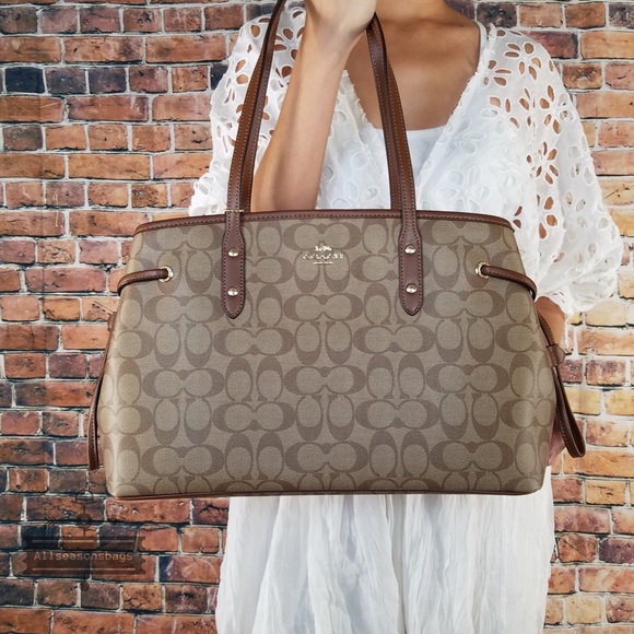 Coach Handbags - Coach signature PVC drawstring khaki brown tote